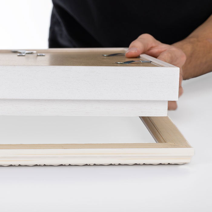 Så lægger du Unibox-udvidelsessættet ned i billedrammen.